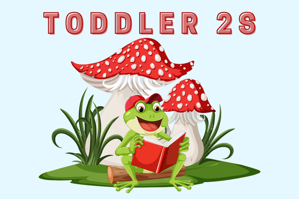 frog reading under a mushroom to toddler 2s